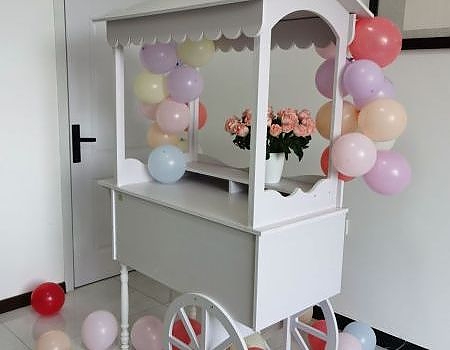 White cart with balloons at a Vallejo event