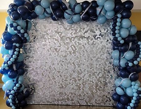 Balloon wall with silver and blue backdrop for event