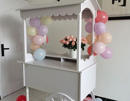 A white cart with balloons in San Francisco Bay Area
