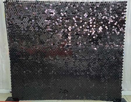 A black wall with shiny decorations for a Bay Area party