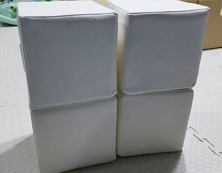White cubes arranged for a birthday party setup