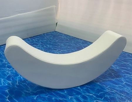  A white curved object on a blue surface at an event