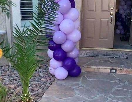 Purple and white balloon column for a Vallejo event