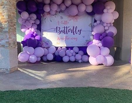 Balloon arch with sign for a San Francisco Bay Area party