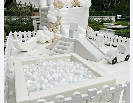 Playground setup with balls and fence for party in Vallejo